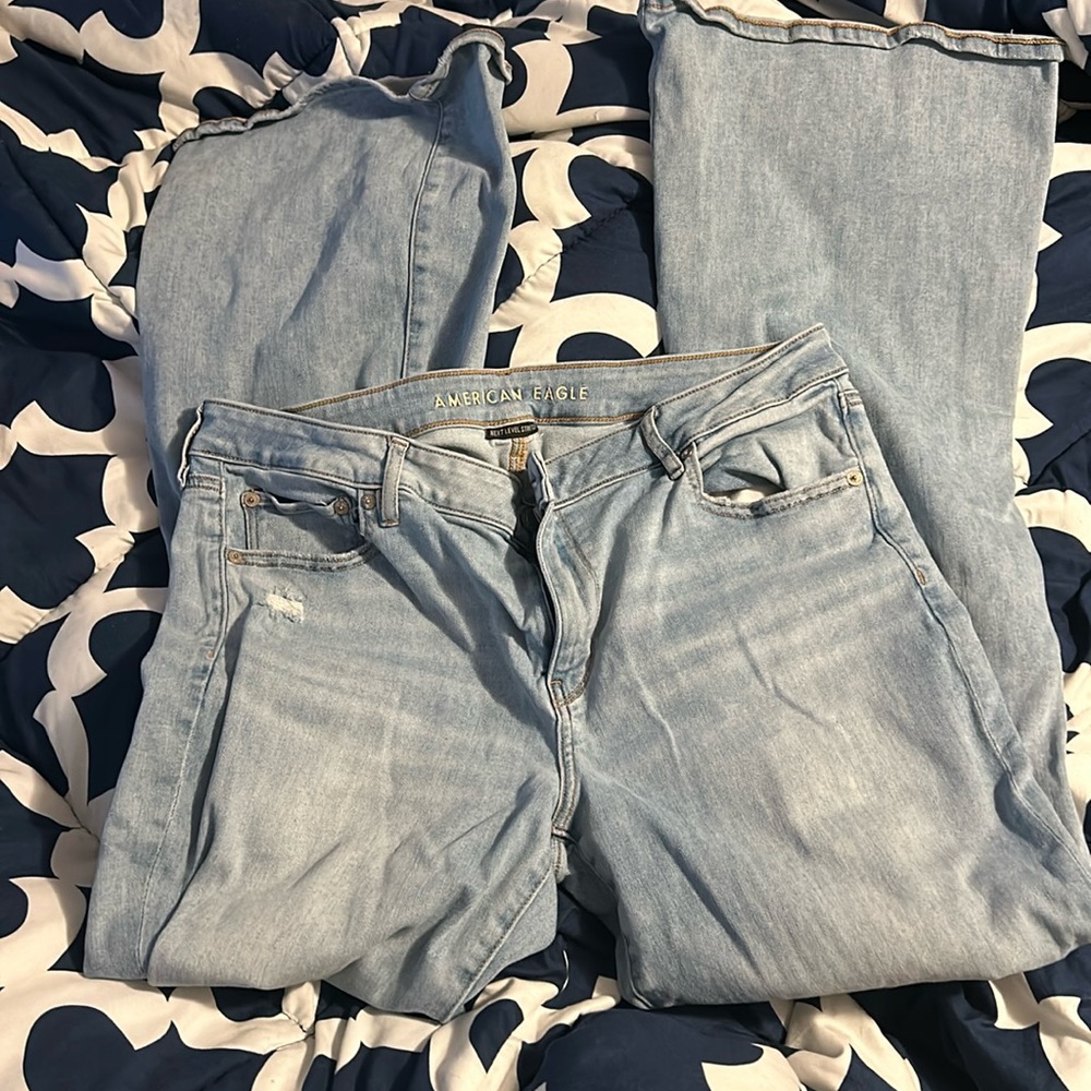 Long length Low Rise Flare distressed jeans from American Eagle